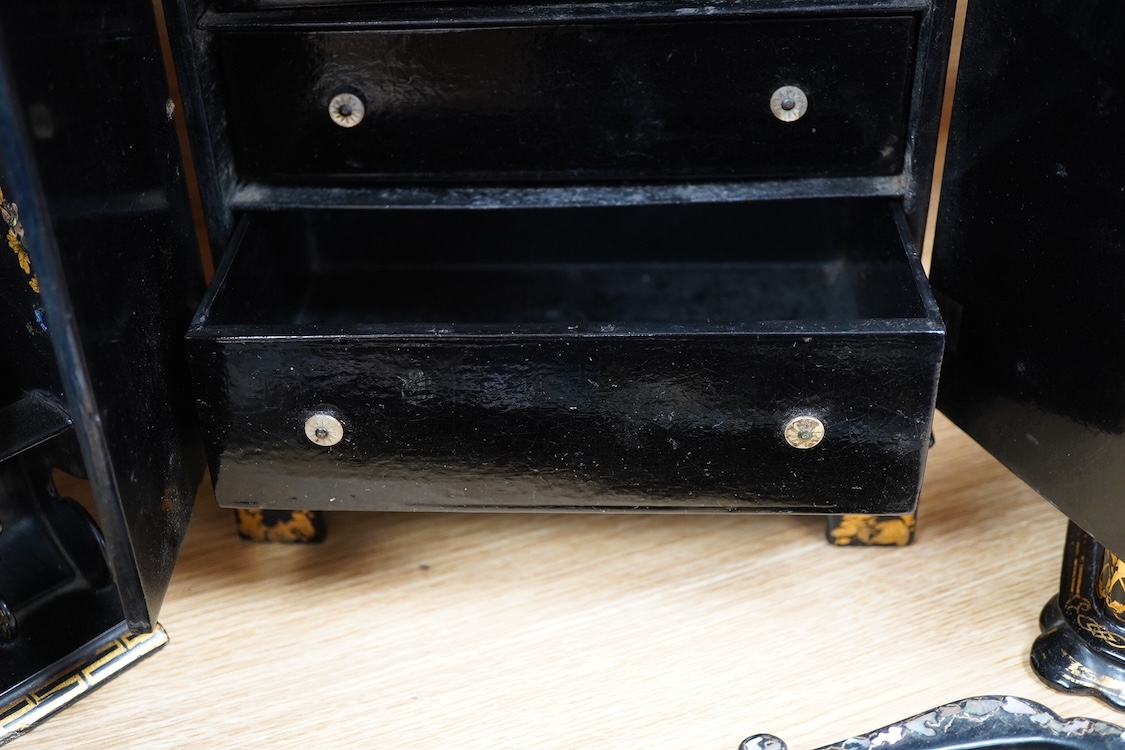 Four 19th century mother of pearl inlaid papier mache items, to include, a four drawer cabinet, 26.5cm high, a tea caddy, letter rack and pen dish